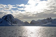 04A Mount Fourcade On Left And Other Mountains Near Cuverville Island From Quark Expeditions Antarctica Cruise Ship.jpg